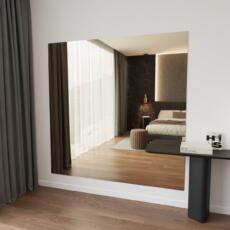 Brede brons gekleurde spiegel aan de muur in modern interieur